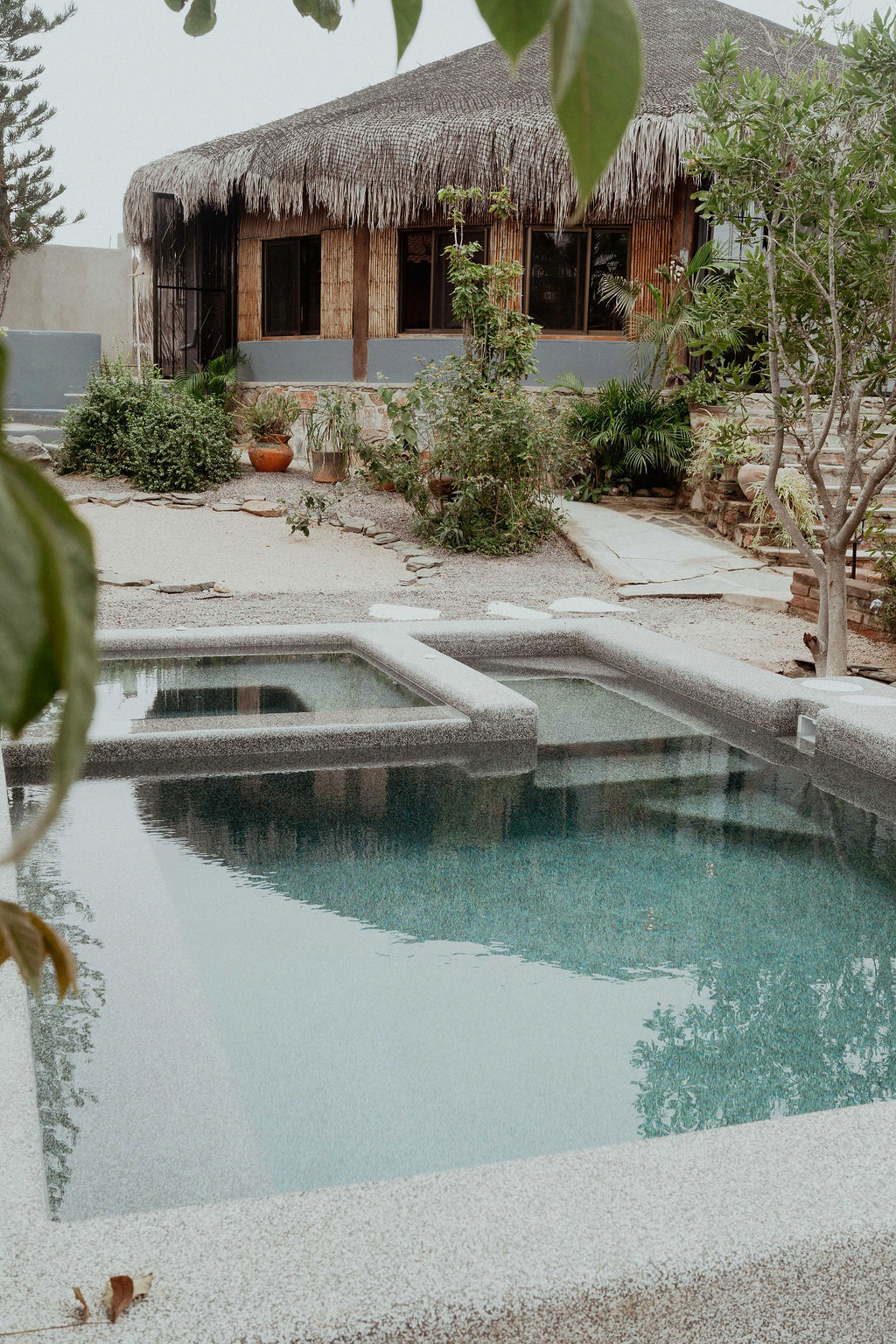 Pool and hot tub with the palapa behind