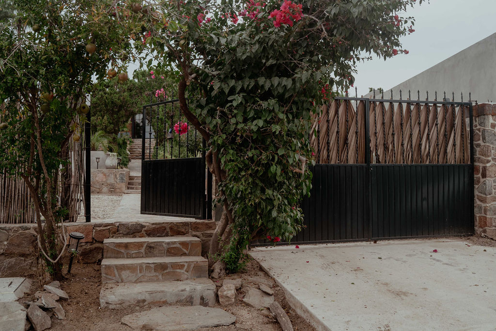 Stone garden path leading to the main palapa